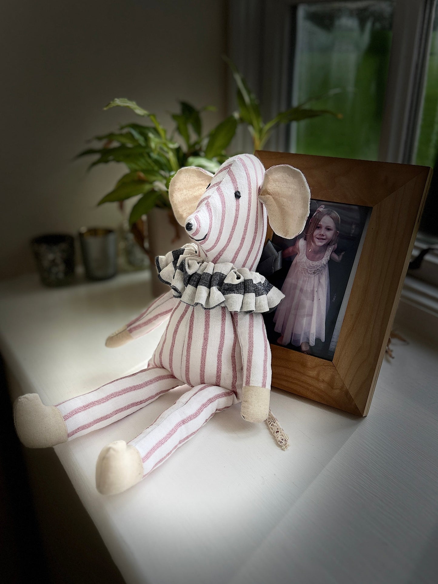 Stuffed toy animal with striped body.